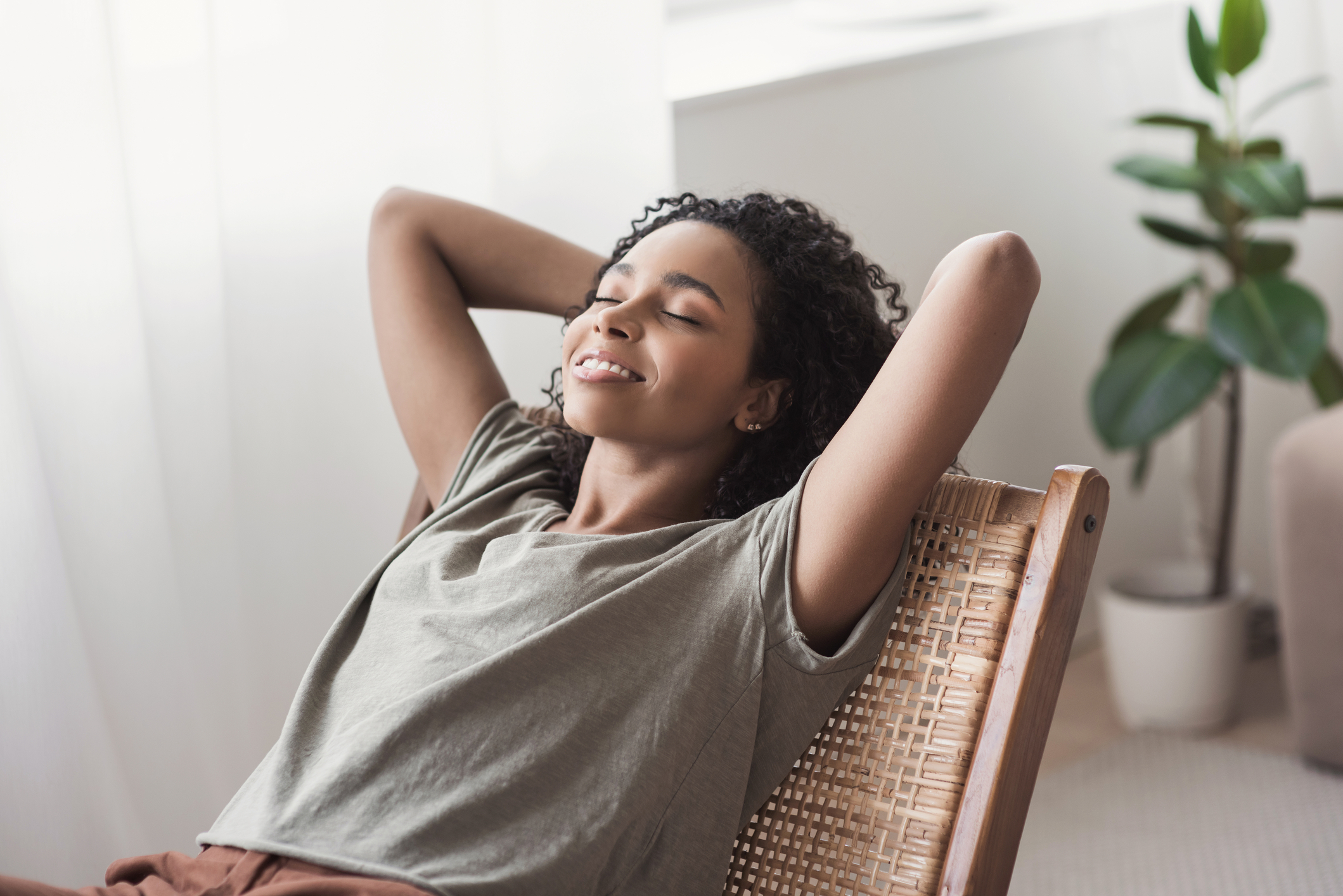 woman relaxing, slowing down, and enjoying wellness