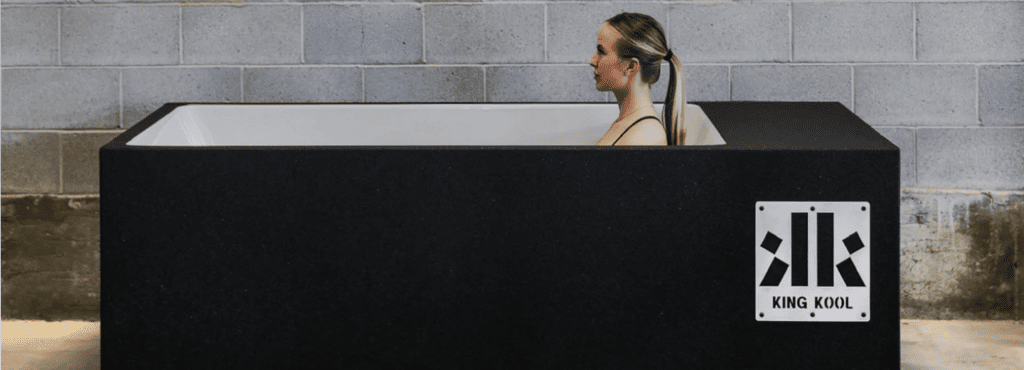 a woman in a cold tub for cold water therapy