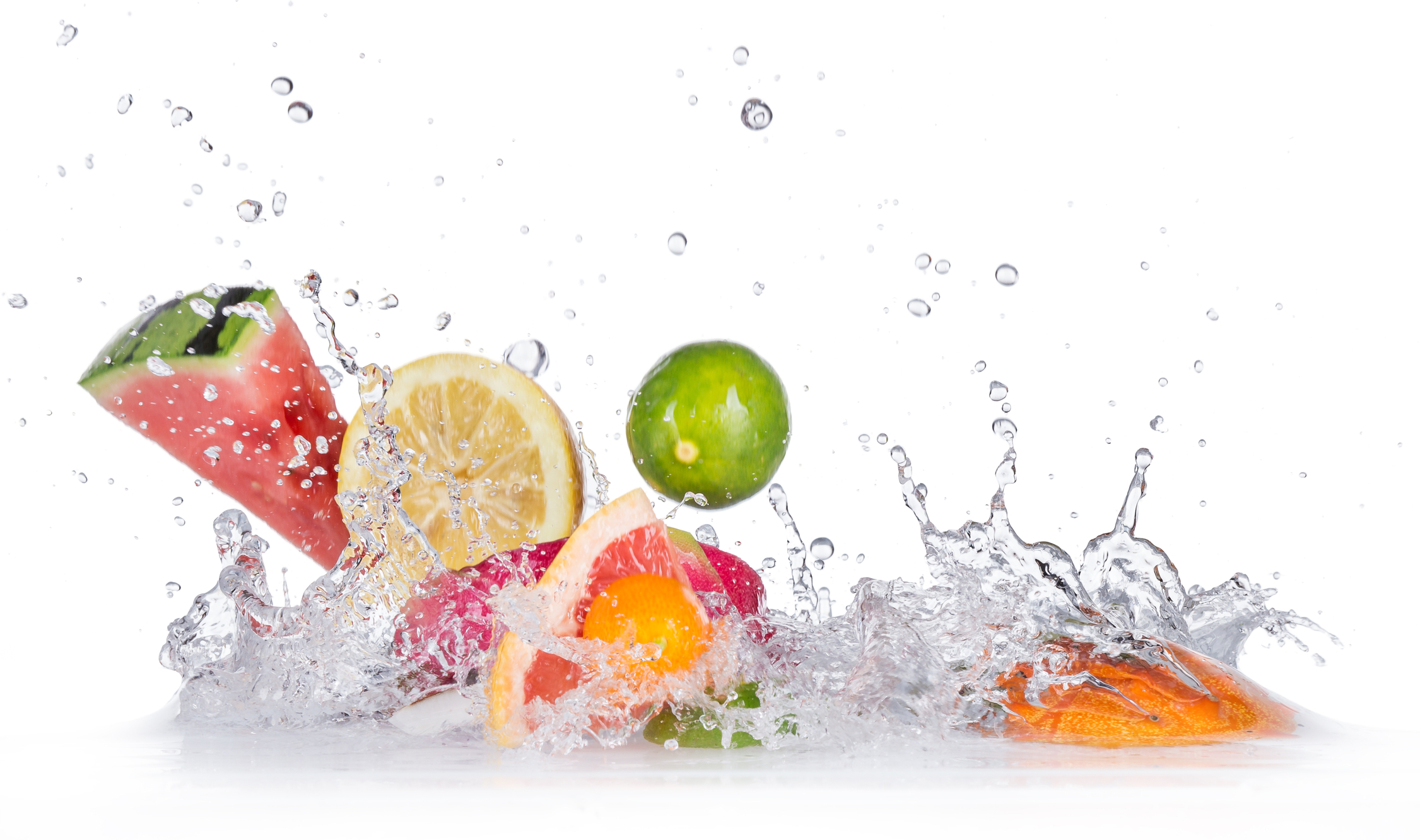 water splashing on fruits like water melon and oranges to eat and drink after a sauna session